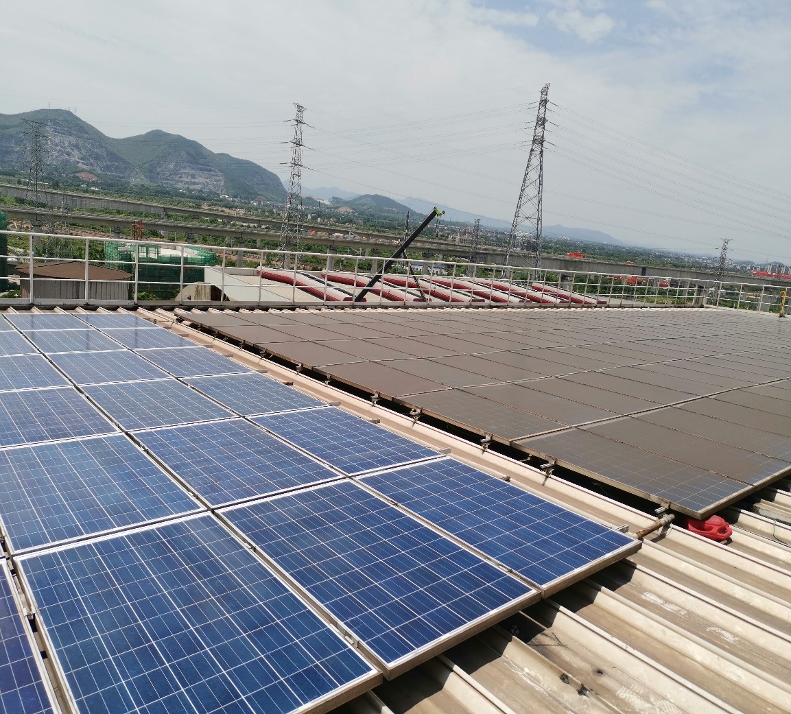 A distributed rooftop PV array — the type of site where soiling and front-surface reflection set the ceiling on output.